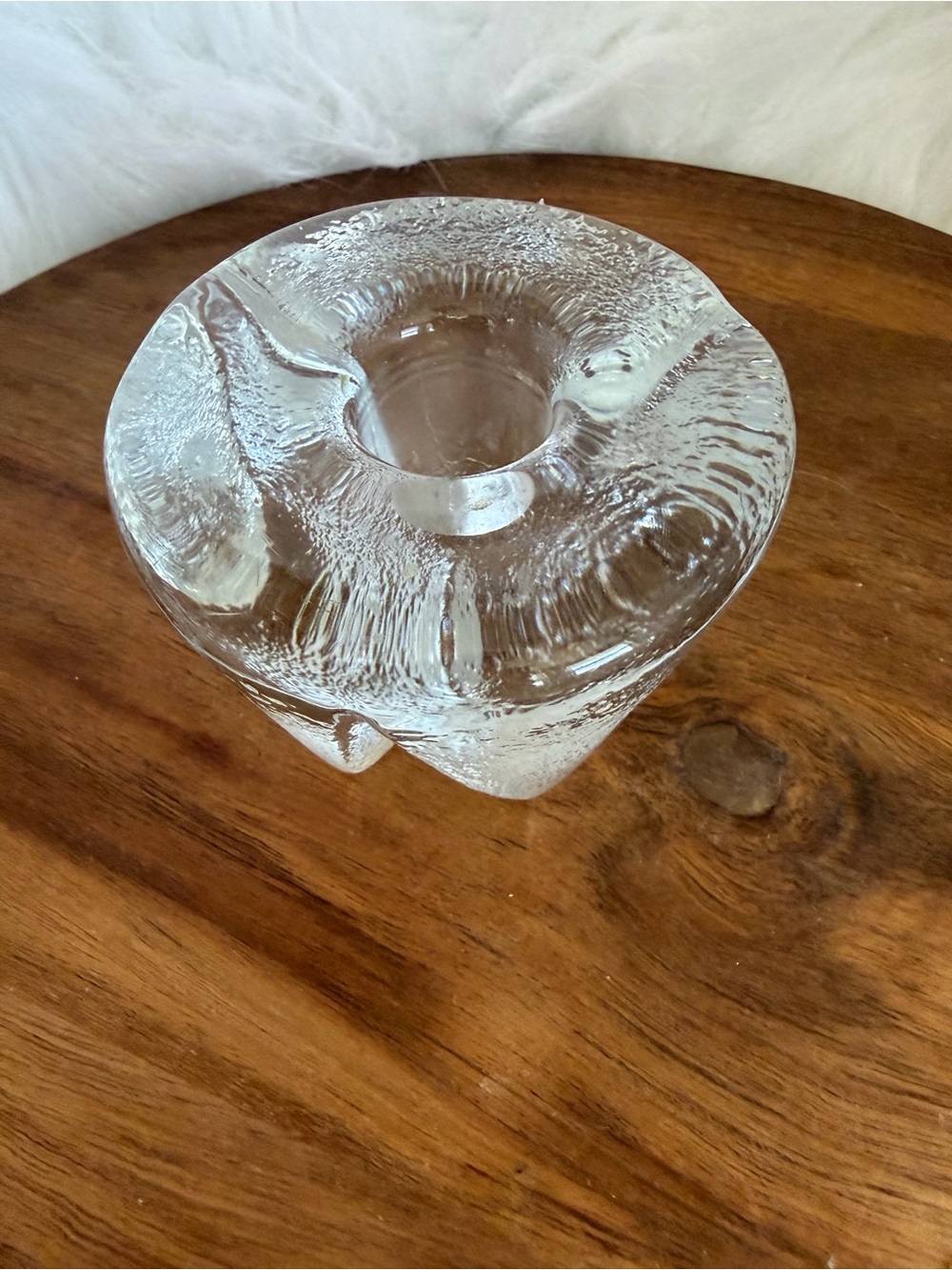 Vintage Blenko clear glass tripod candleholder with textured surface.